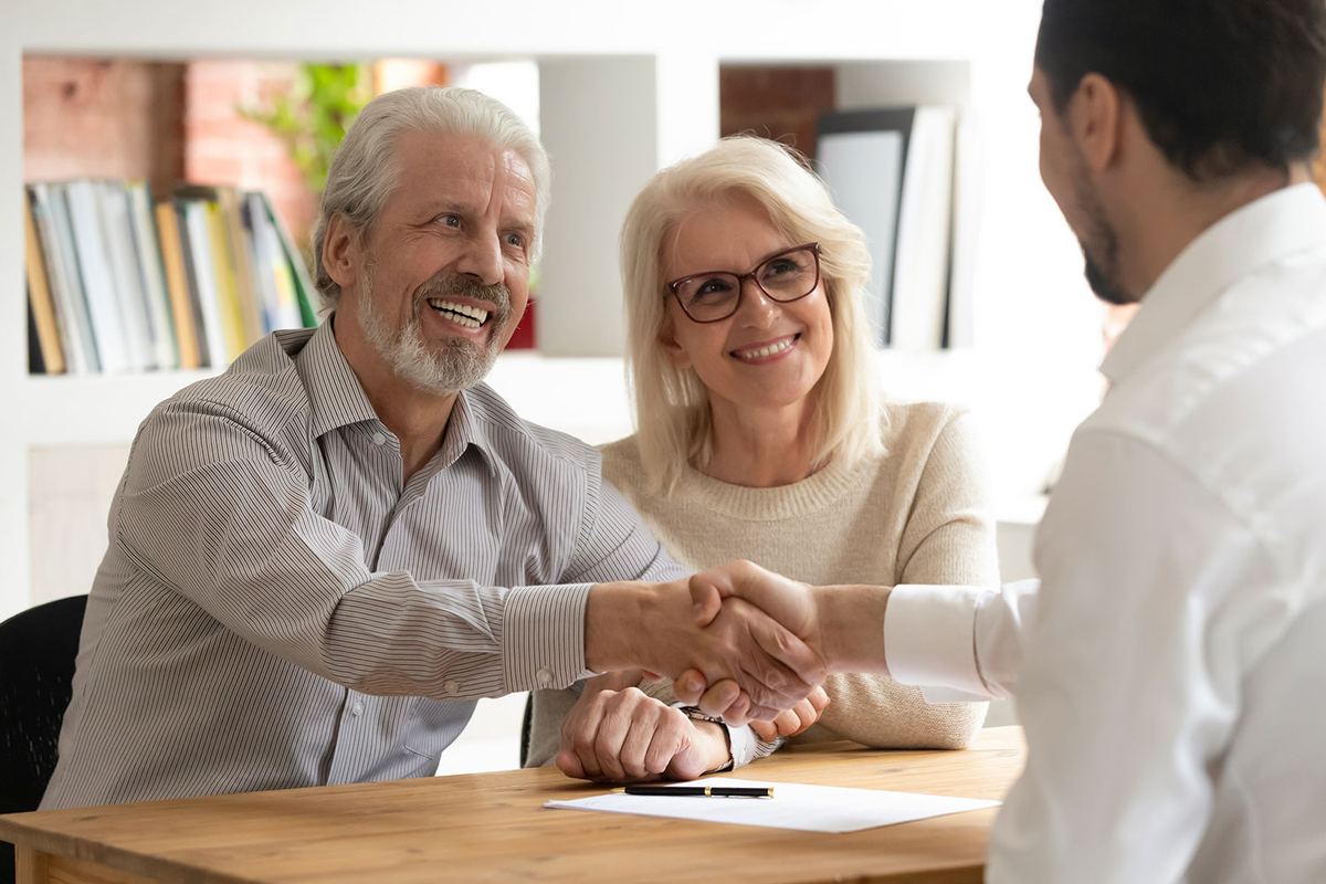 Retired couple reviewing their portfolio strategy